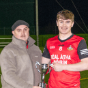 Ballyporeen captain Jason King receives the cup from Declan Hickey, Vice Chairman of South Tipperary Bord na nÓg. Picture: Michael Boland