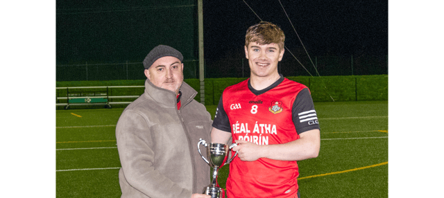 Ballyporeen captain Jason King receives the cup from Declan Hickey, Vice Chairman of South Tipperary Bord na nÓg. Picture: Michael Boland