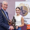 Cllr Declan Bree, Chair Sligo Co Council presenting the trophy of The Fiddler of Dooney sculptured by late Fred Conlon, to this year’s winner Laoise Kennedy (Nenagh, Co. Tipperary).