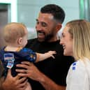 Cape Verde footballer Pico Lopes with his wife Leah and eight-month-old son Diego as he returns home after taking part in the World Cup
