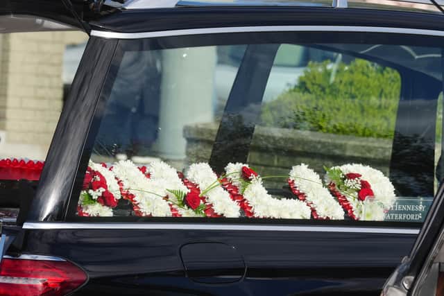 Flowers for Philip English, outside Sacred Heart Church Parish Centre (Brian Lawless/PA)
