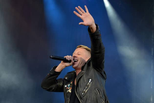 Macklemore performing on stage