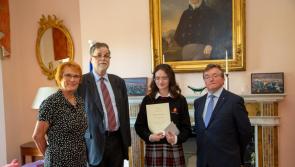 A student and teacher from Coláiste Phobal Roscrea win prizes at this year's  German Essay Writing Awards