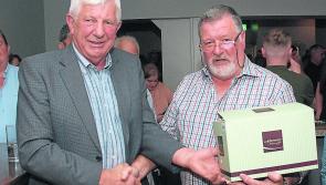 PICTURE: Tipperary community host function for this postman hanging up his delivery bag
