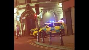 Stricken pedestrian being attended to by emergency services on main street in Nenagh