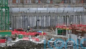 Government and contractor trade accusations over spiralling hospital costs